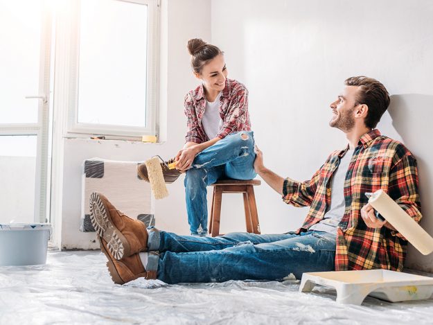 Avoid These 7 DIY Home Improvement Mistakes – Tips for Sellers and Homeowners Homeowners fixing a DIY project gone wrong, embodying the challenges and solutions in home improvement.